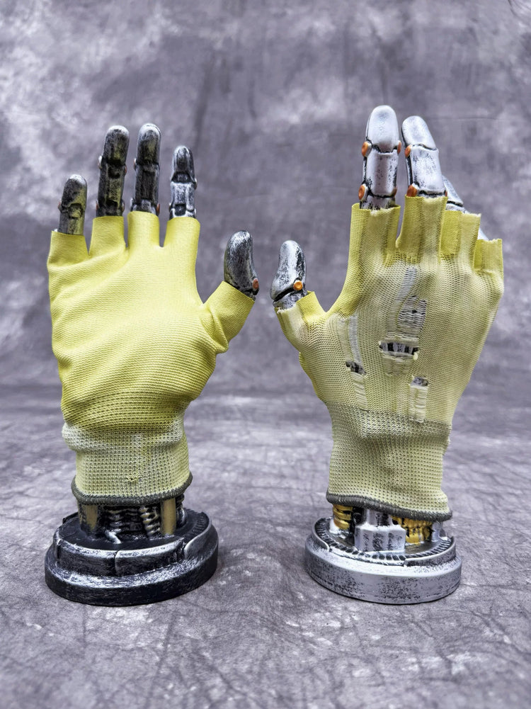 PRECISION CASTING distressed fingerless gloves in nebula green — coated fingerless gloves on upright metal display hands
