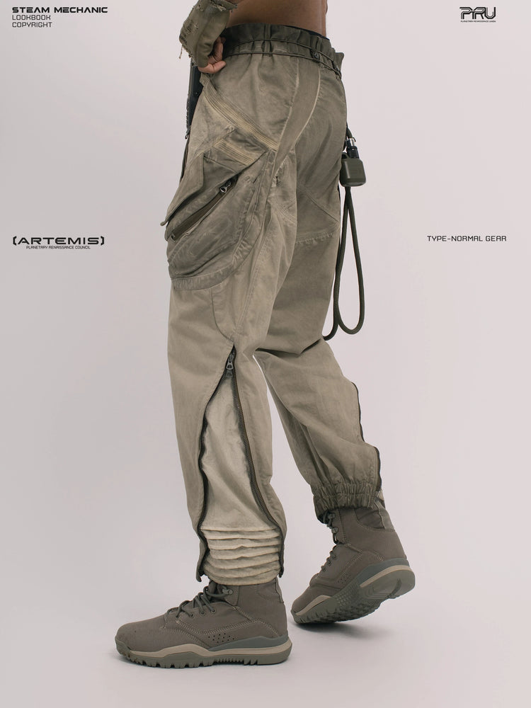 AEGIS lunar soil teal multi-pocket moto pants — rear three-quarter modeled view with one heel raised