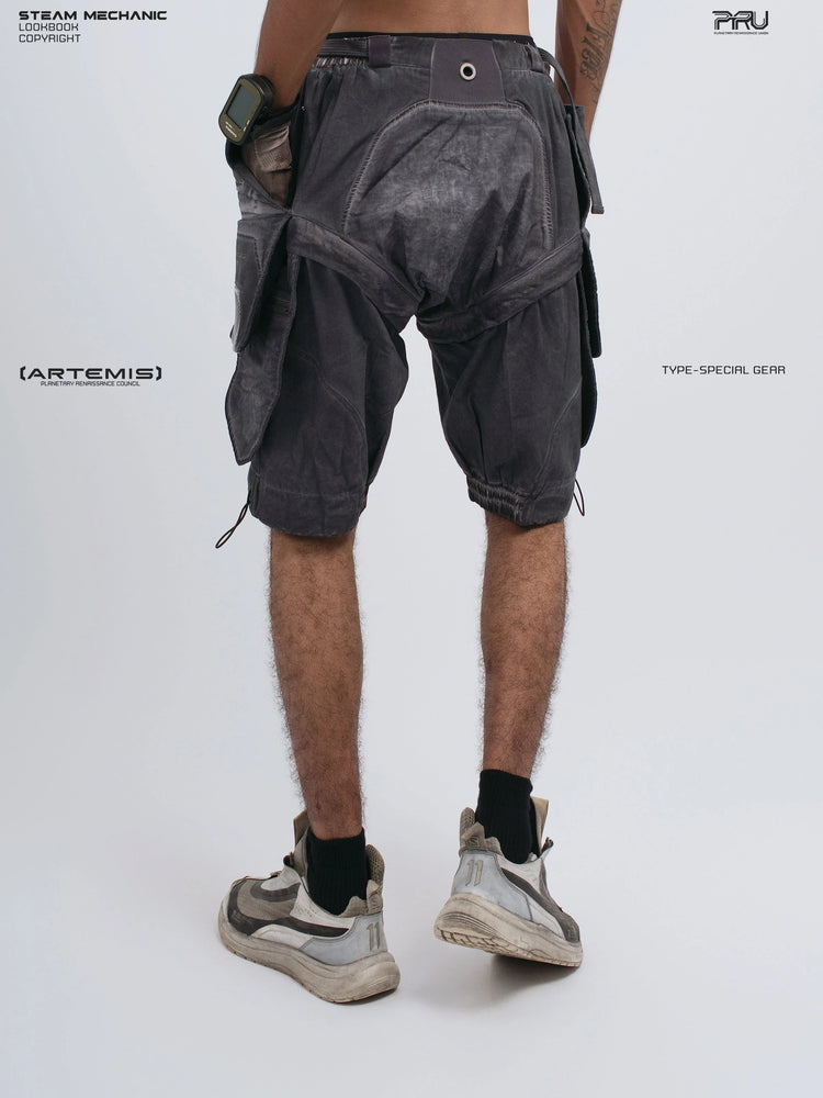 ARTEMIS stellar blue detachable technical shorts — rear three-quarter view with hands down