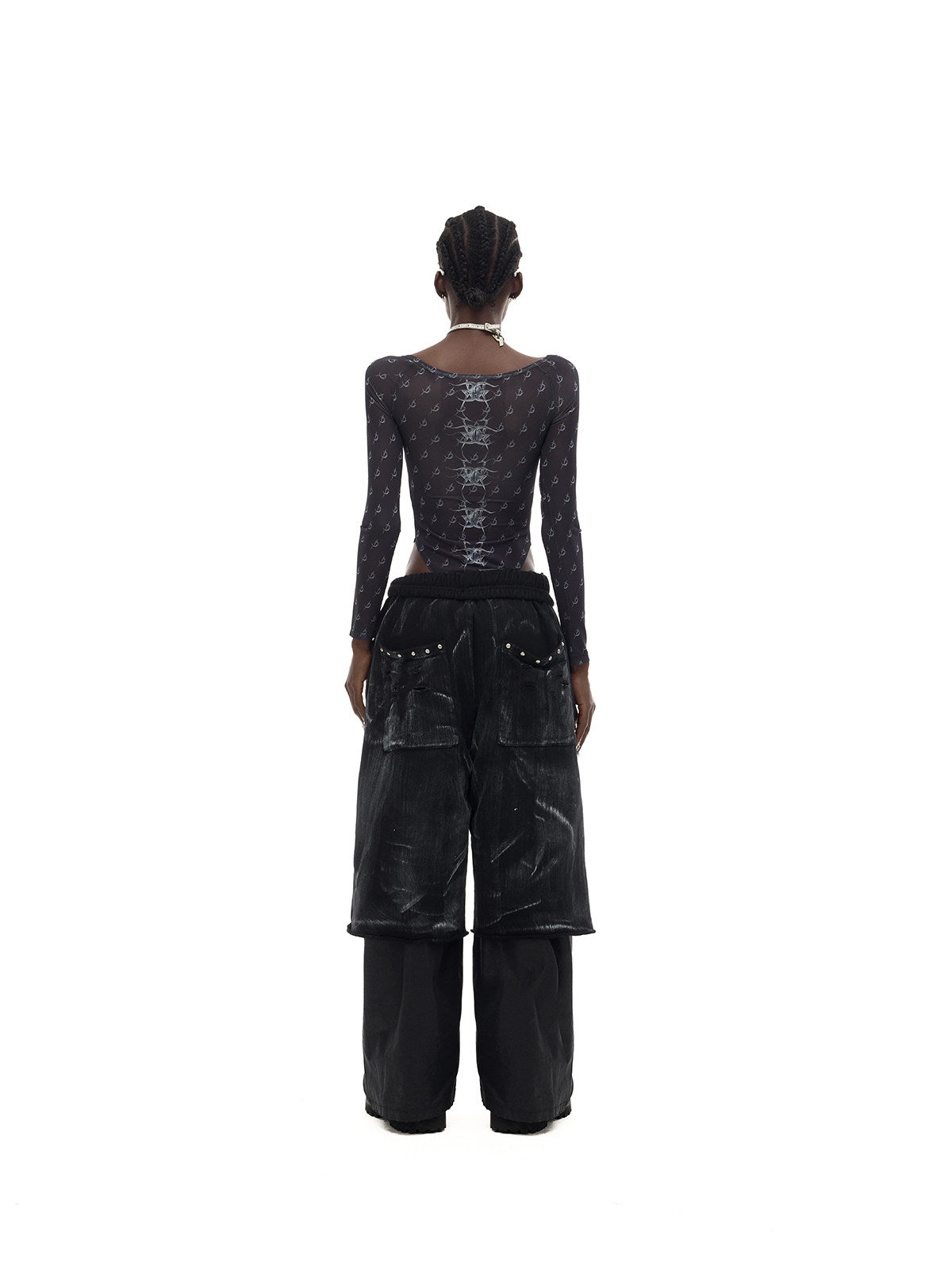 PINKSPINK ELECTRIC MOON coated cropped wide-leg pants in black — rear full-length modeled view showing the wide cropped silhouette