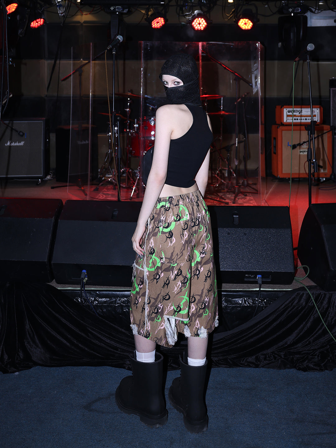 PINKSPINK ELECTRIC MOON distressed camo cropped trousers in CAMOUFLAGE — rear three-quarter with black hood.