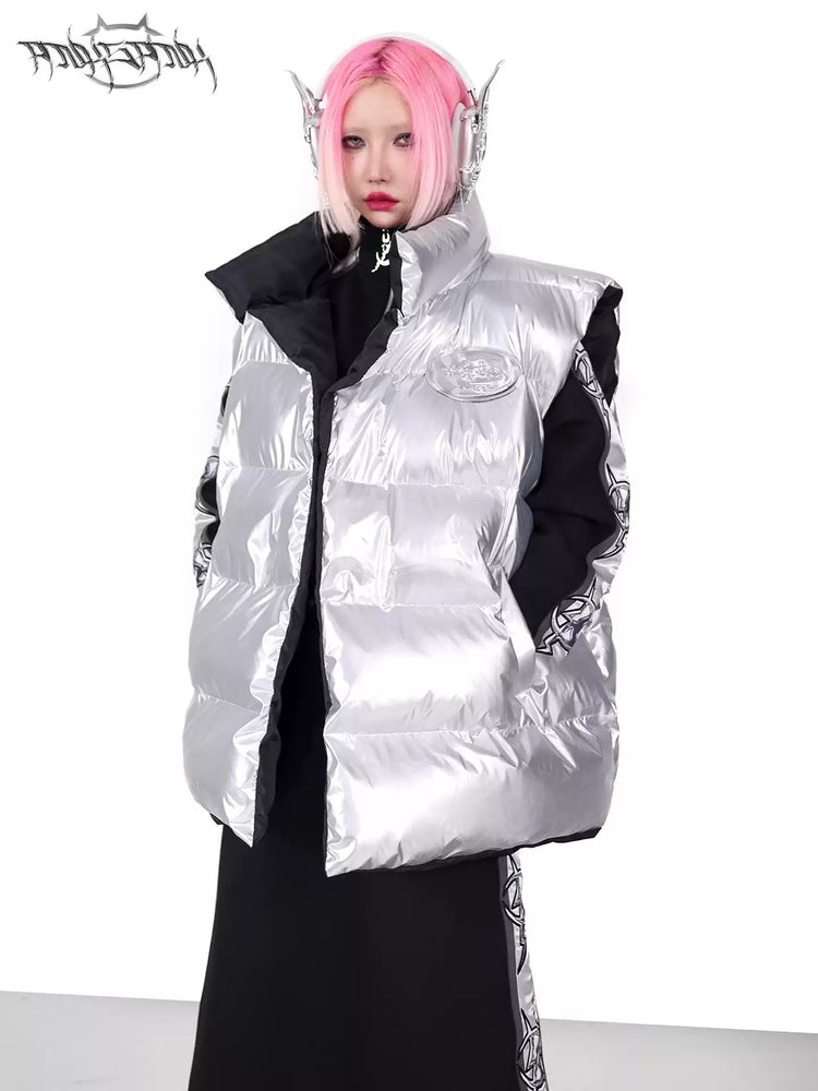 PINKSPINK ORBIT reversible padded vest in black silver — silver-side modeled close-up showing the high collar and logo badge