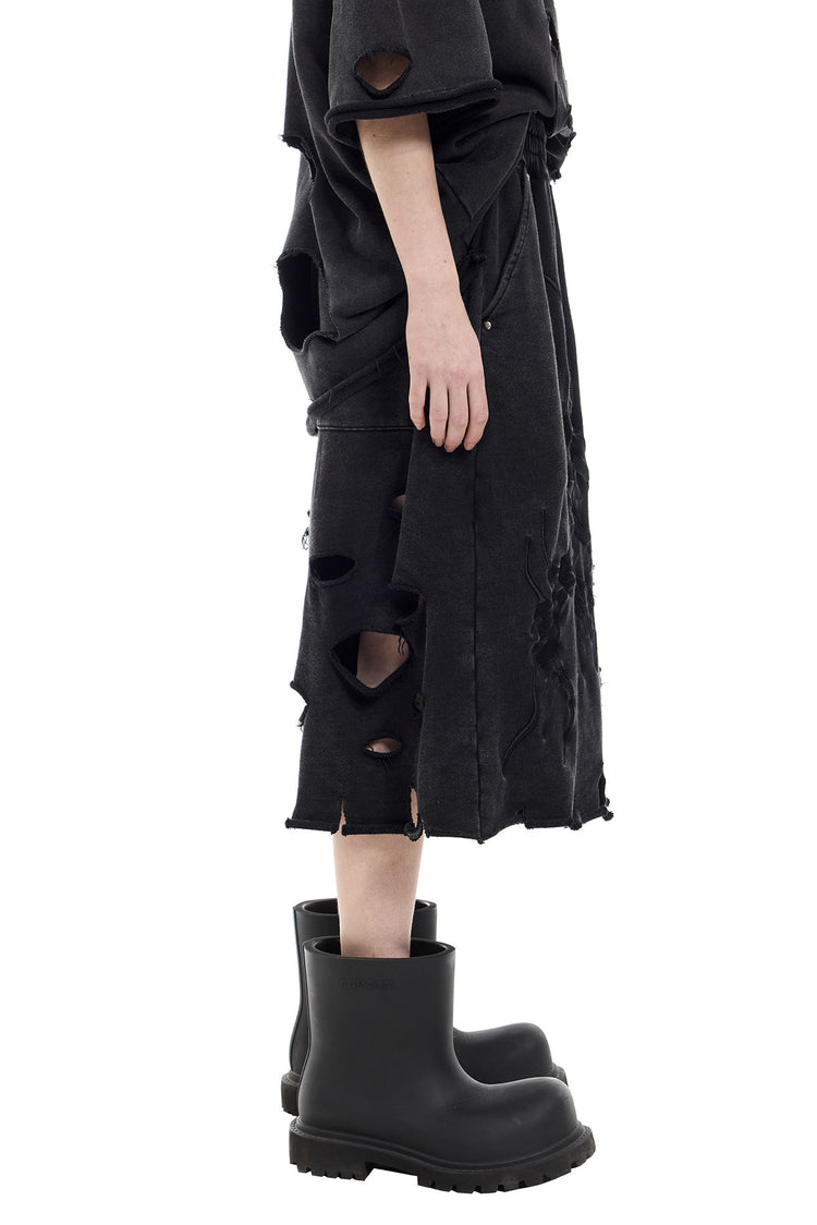 PINKSPINK ELECTRIC MOON distressed embroidered wide-leg shorts — black — opposite side view showing the loose leg shape