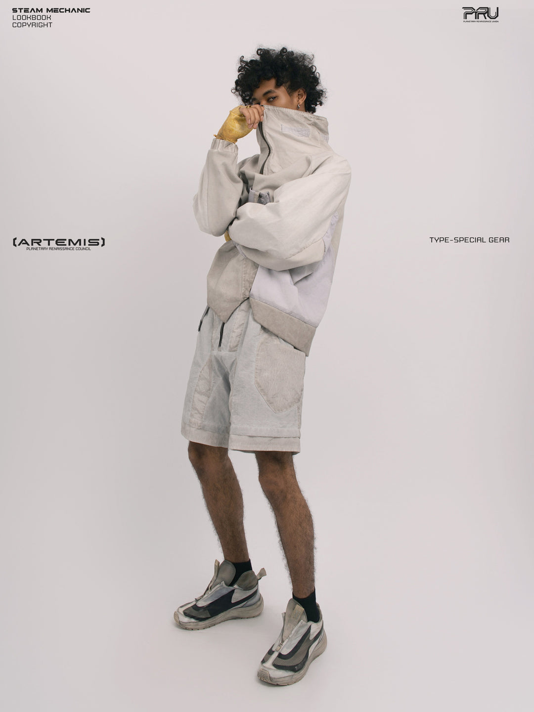 PIONEER eris white detachable-pocket utility hoodie — side modeled view with hands at the high collar