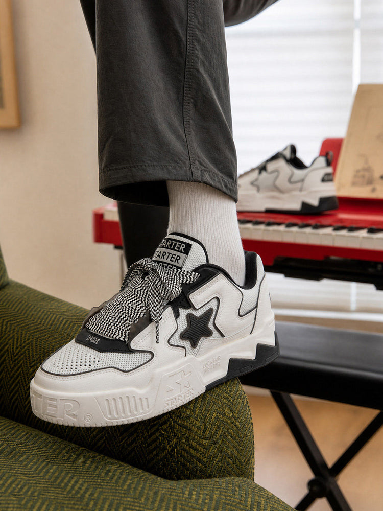 Black-and-white STARTER VOL 90S mesh sneaker worn on foot, three-quarter view