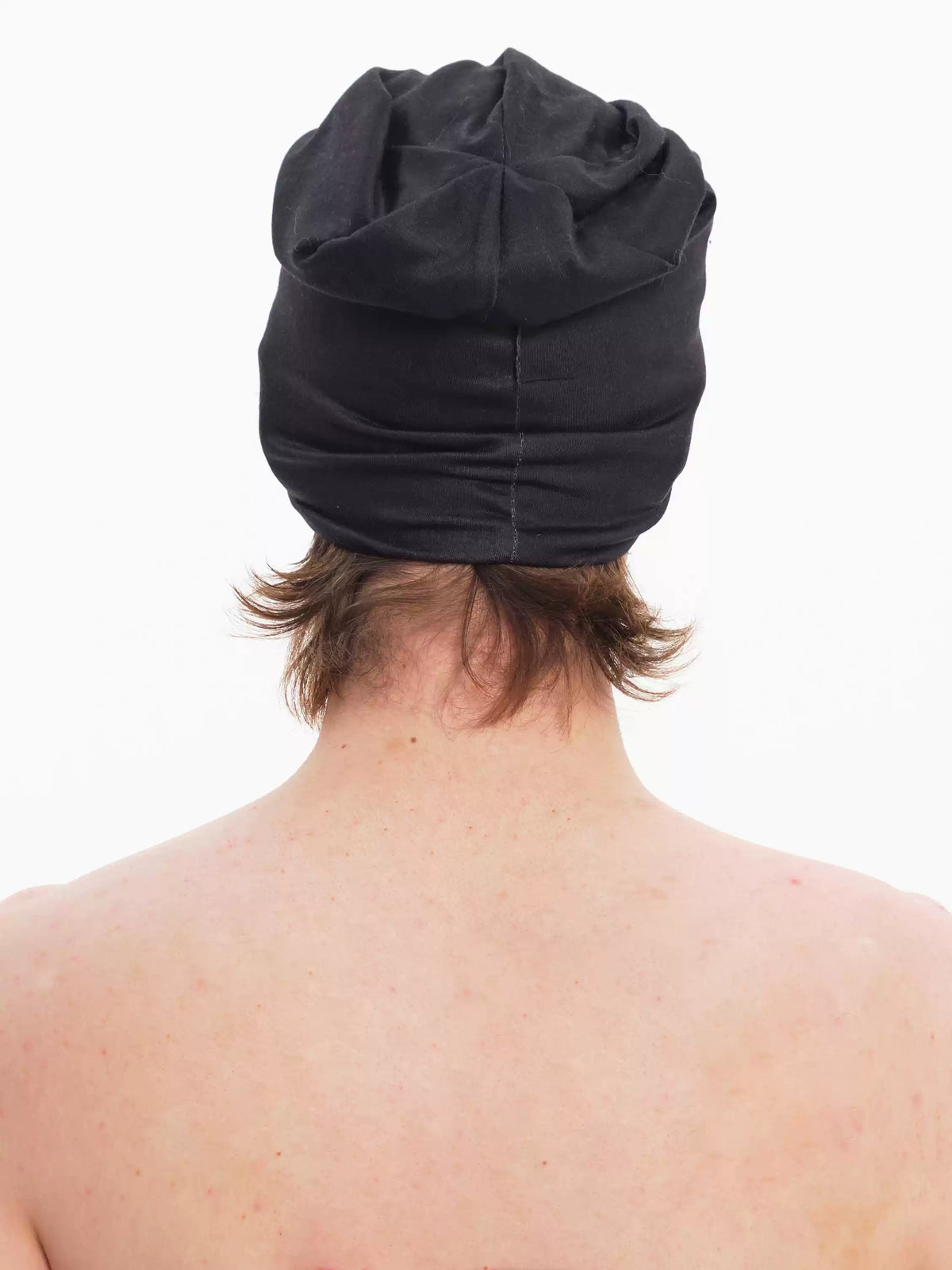 EMBRYO PLAN black graphic slouch beanie — side modeled view