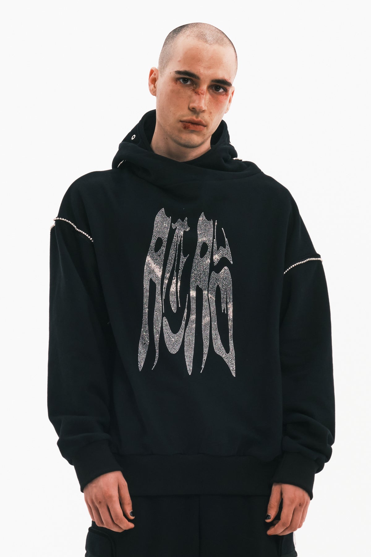 EMBRYO RHINESTONE RING oversized graphic hoodie — black front modeled view with hood down and arms relaxed