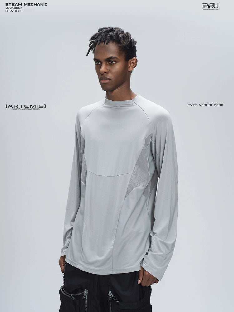 ARTEMIS moon dust gray stretch technical base-layer top — opposite three-quarter modeled view of the tonal panel construction