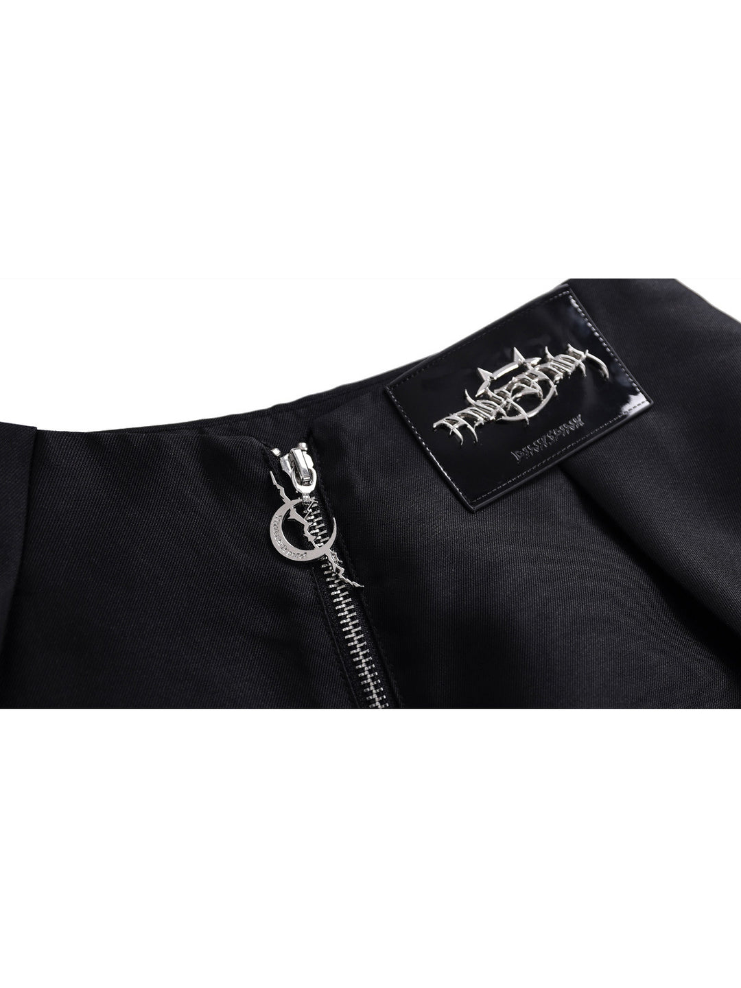 PINKSPINK GARFIELD graphic mini skirt — black rear zipper and brand patch close-up