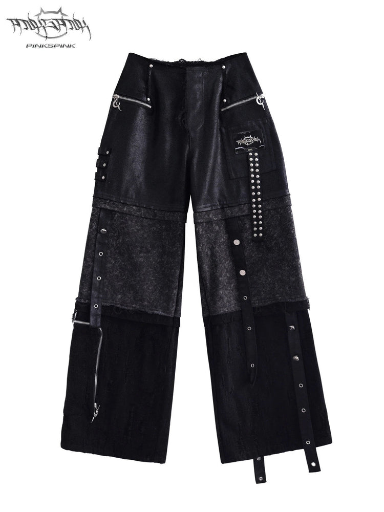 PINKSPINK RECOMBINATION stacked low-rise jeans in black — solo front view of the black patchwork denim jeans.