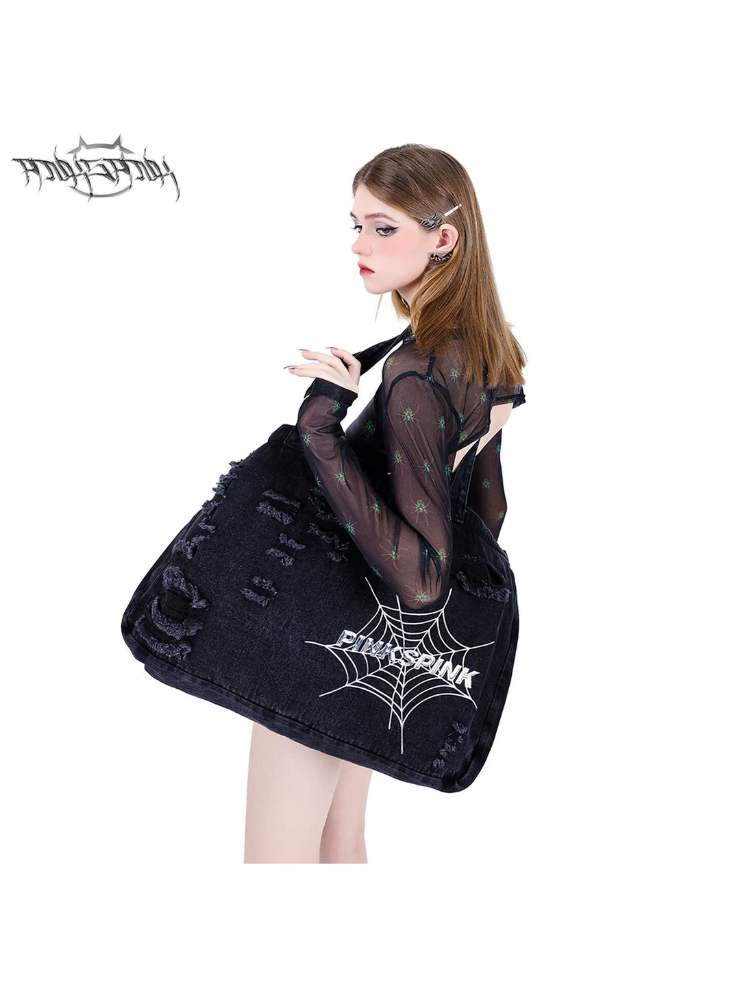 PINKSPINK SPIDER distressed denim shoulder tote — rear three-quarter modeled view showing the distressed tote over one shoulder