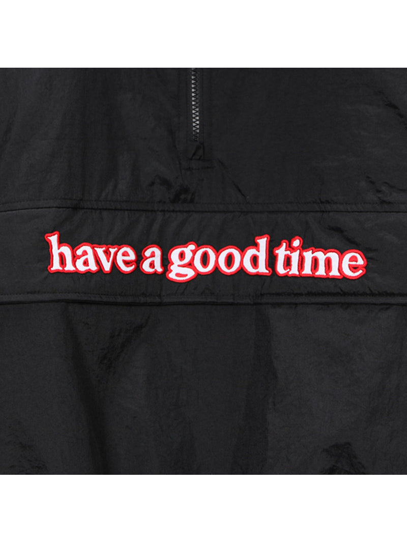 Close-up of the HAVE A GOOD TIME embroidery on the ANORAK jacket front pocket