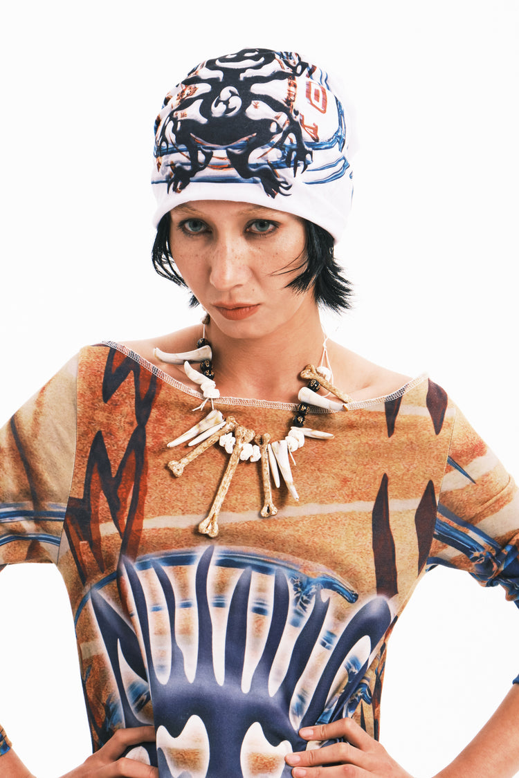 EMBRYO TRIBAL ENTITY graphic slouch beanie — full-length modeled view