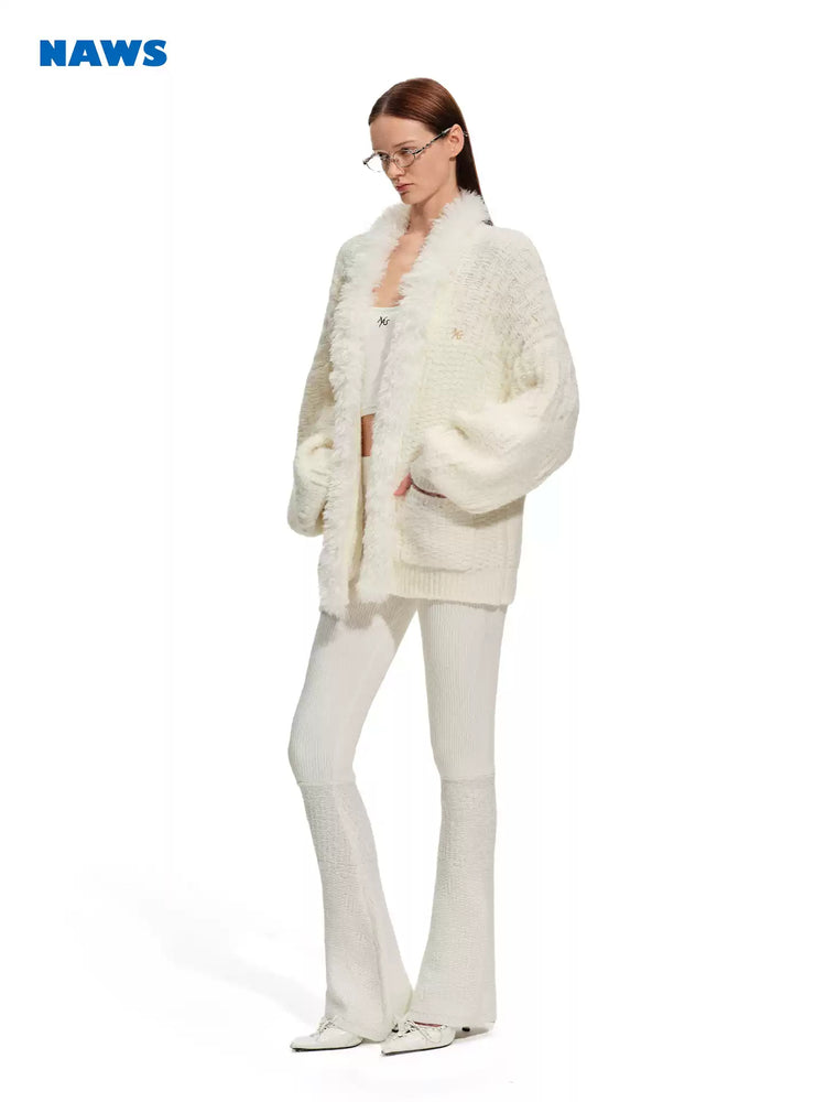NAWS ARCTIC ribbed wool-blend flare pants — close modeled view highlighting the construction