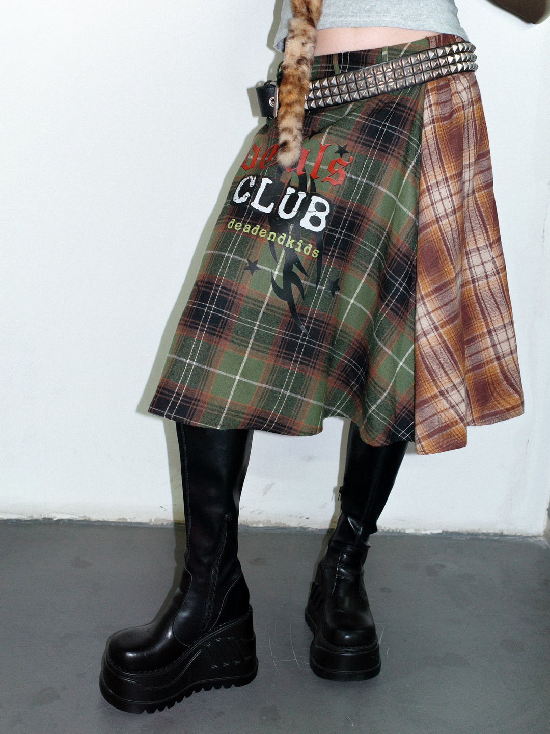 DeadEndKids BadGals Club double-sided plaid A-line skirt — green-brown three-quarter front view