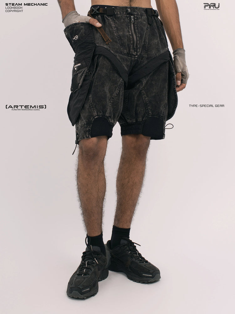 ARTEMIS blackbird black detachable technical shorts — angled front modeled view with hand in pocket