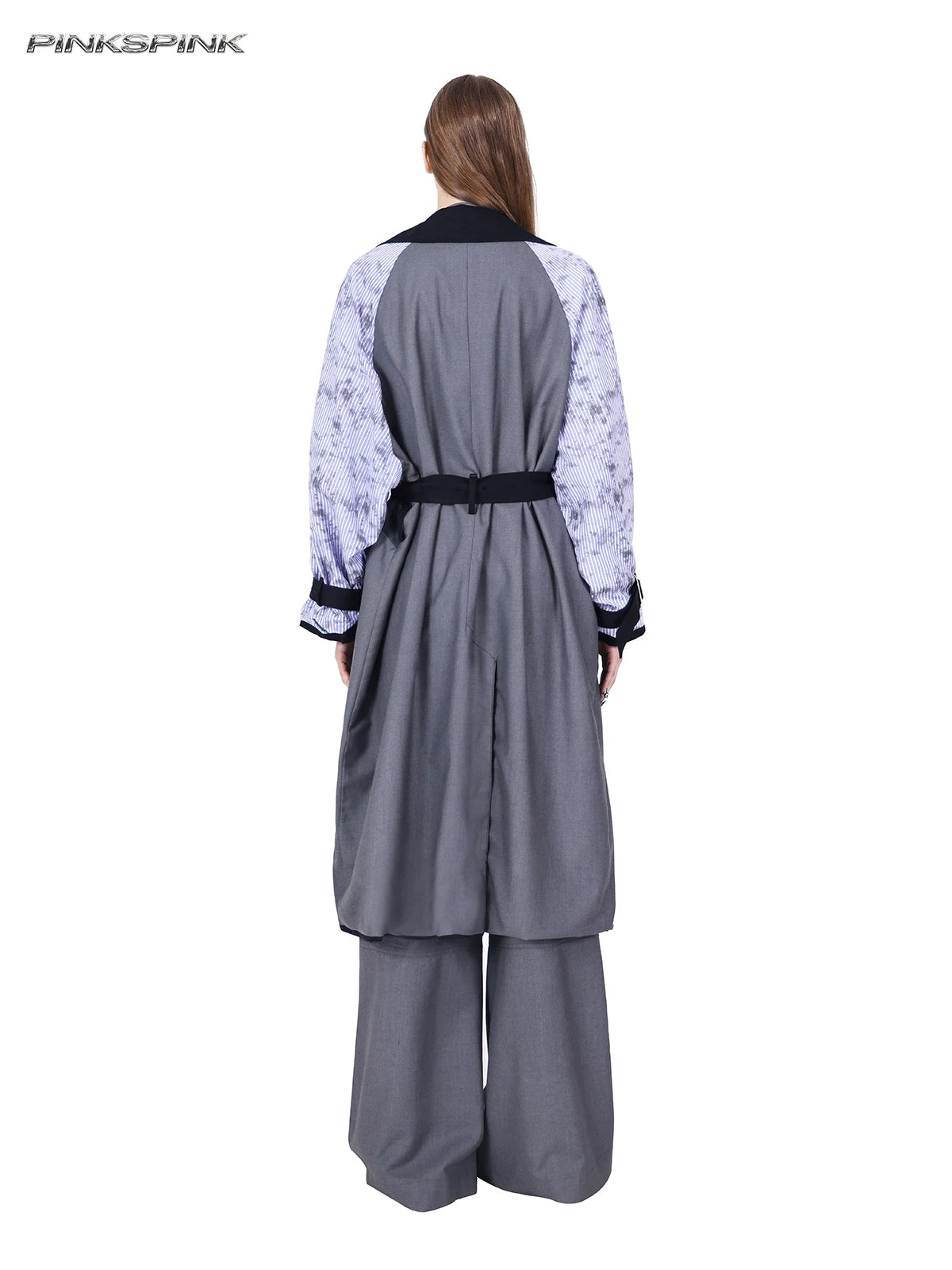 PINKSPINK ELECTRIC MOON reversible patchwork trench coat in black and gray — rear modeled view of the gray reverse with printed striped sleeves