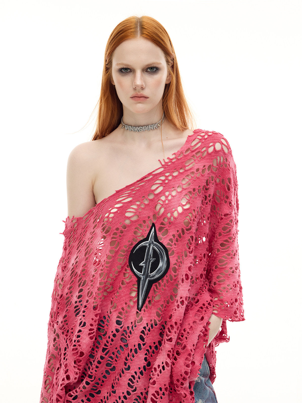 PINKSPINK ELECTRIC MOON distressed open-knit oversized tee in pink — close front modeled view of the distressed knit and moon emblem