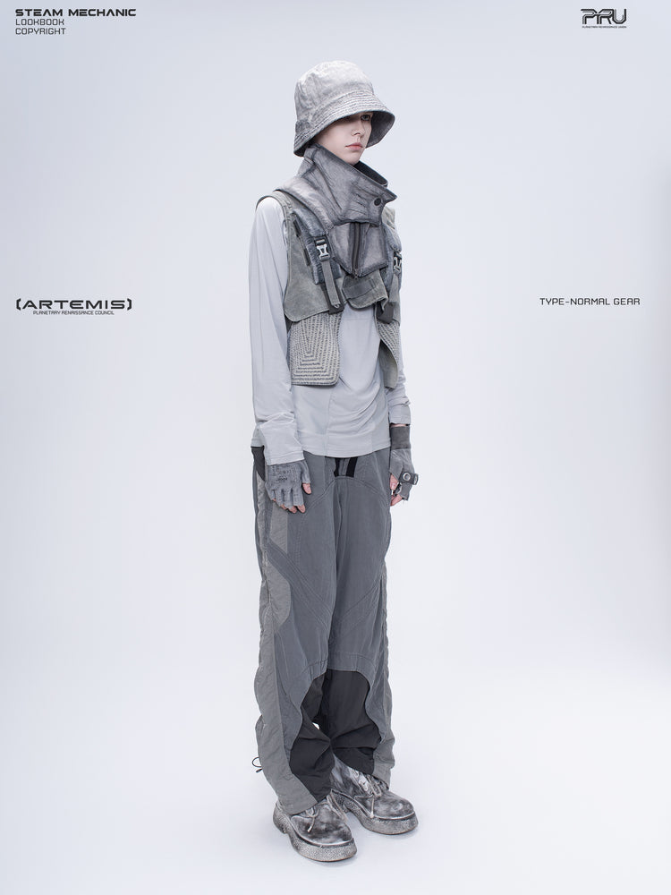 ARTEMIS moon dust gray stretch technical base-layer top — opposite three-quarter modeled view with arms lowered