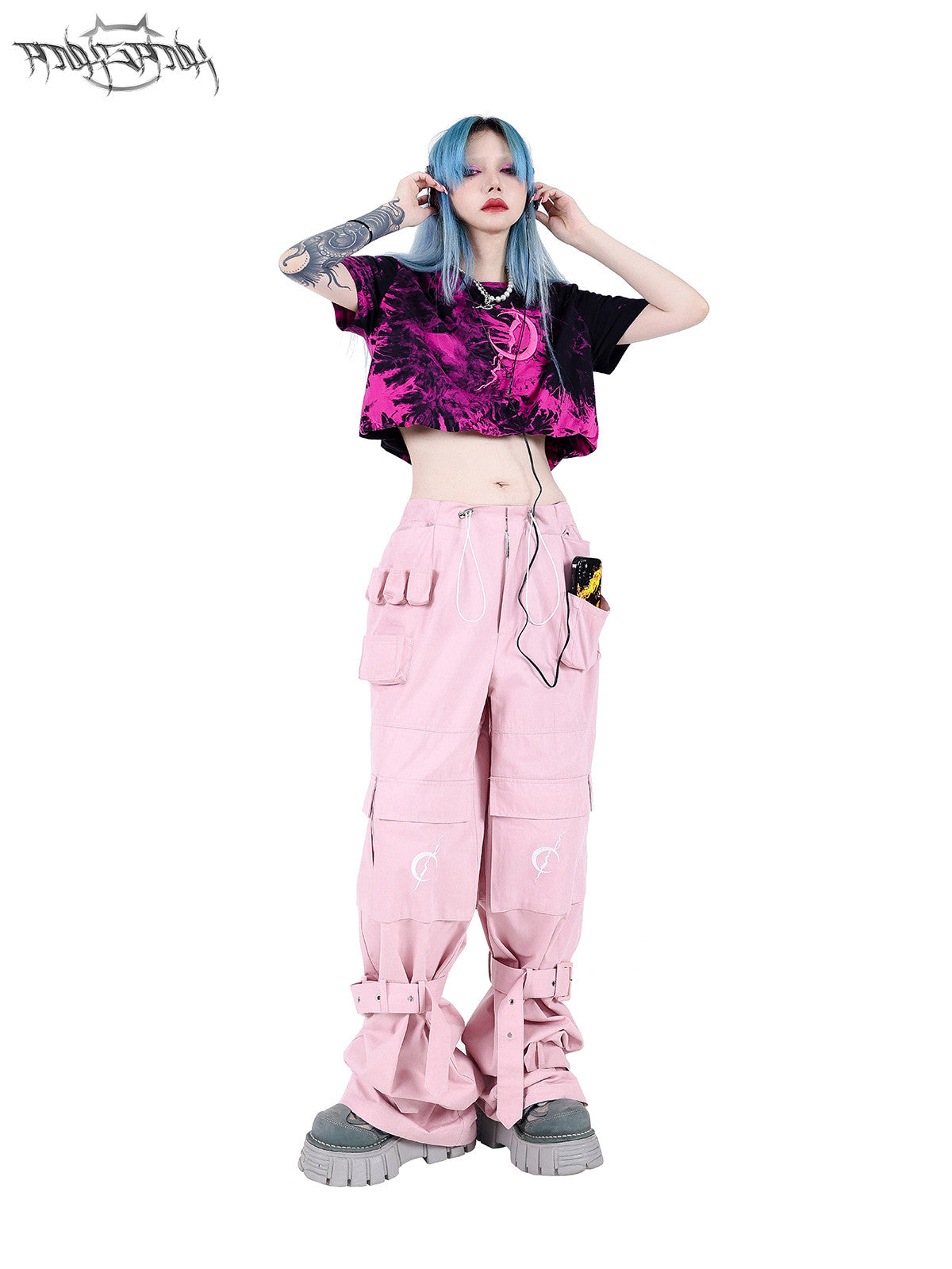 PINKSPINK ELECTRIC MOON double-layer tie-dye crop tee — pink-black full-length modeled view with hands on headphones