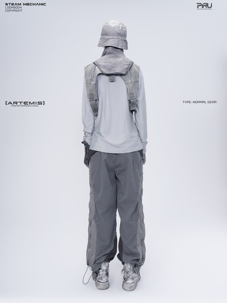 ARTEMIS moon dust gray stretch technical base-layer top — full-length back modeled view with layered vest