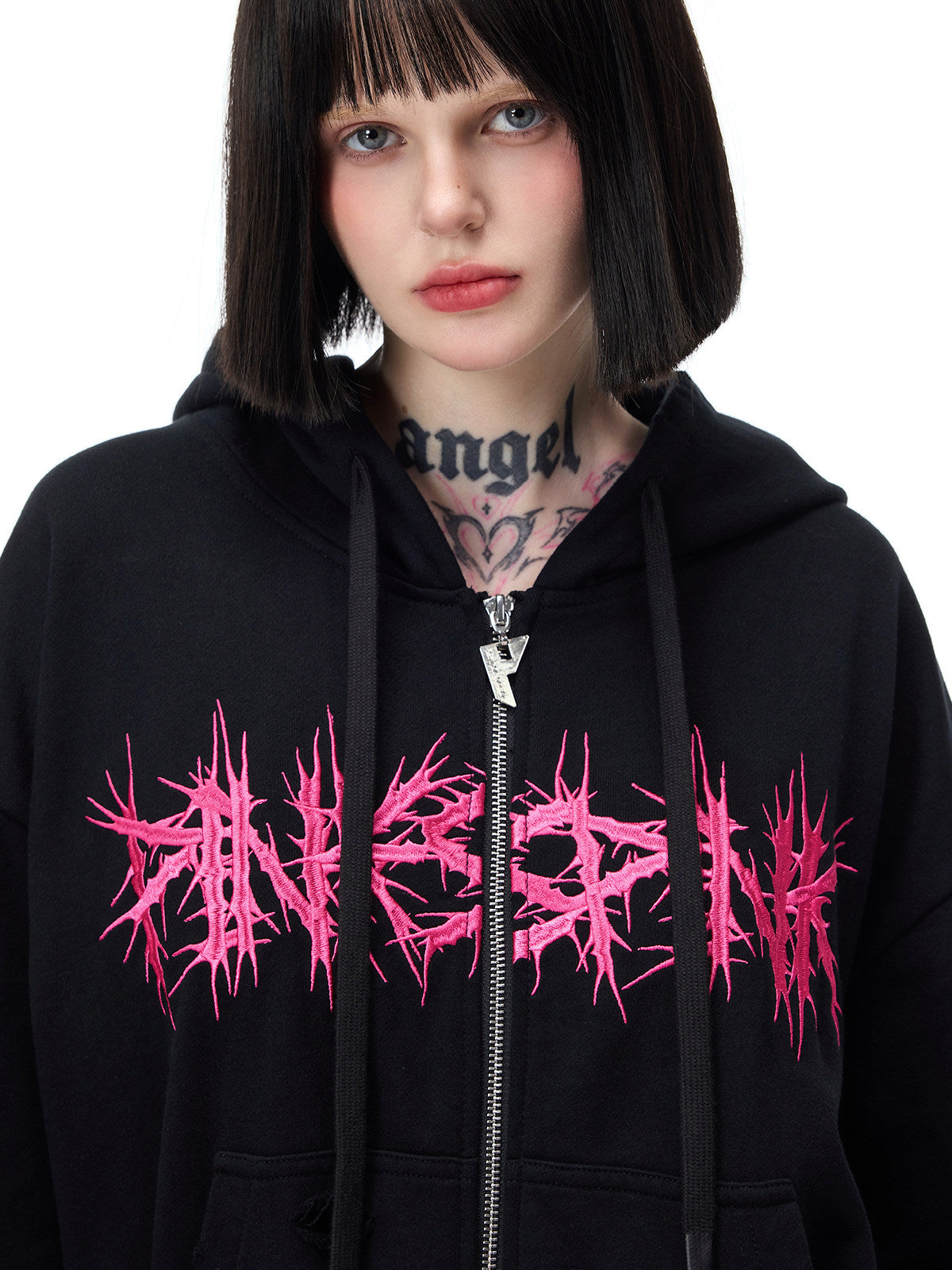 PINKSPINK MOHAWK RITUAL studded zip-up hoodie — front close-up of pink graphic and zipper