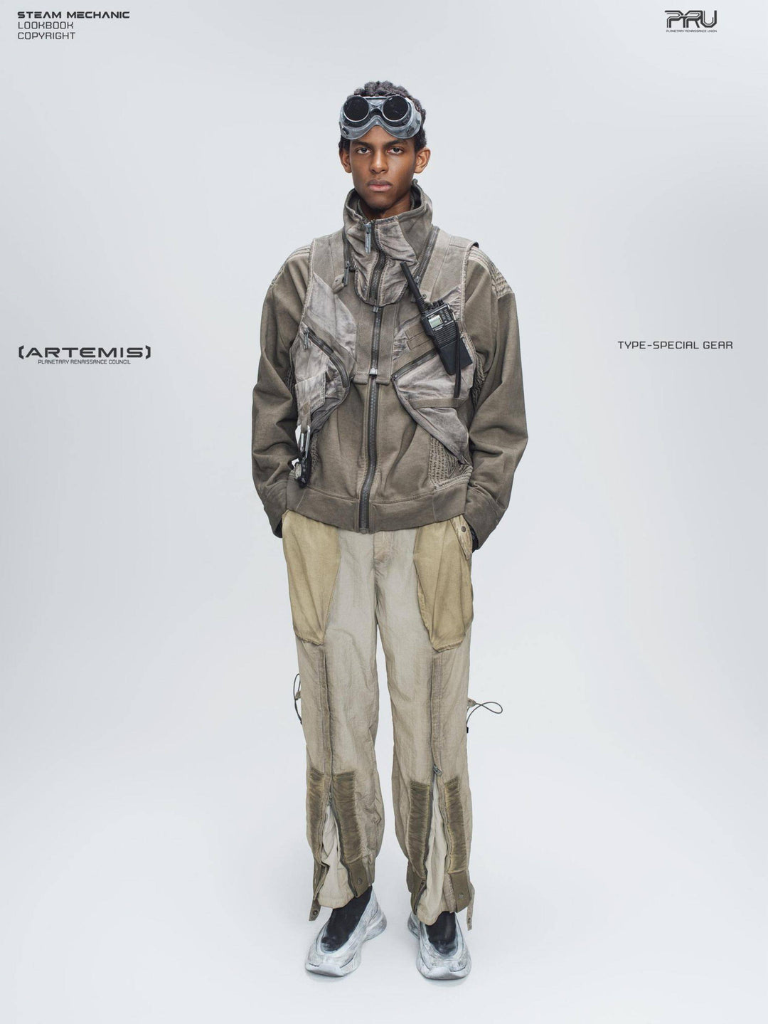 FISSION modular vest — mercury brown full-length front modeled view with hands in trouser pockets