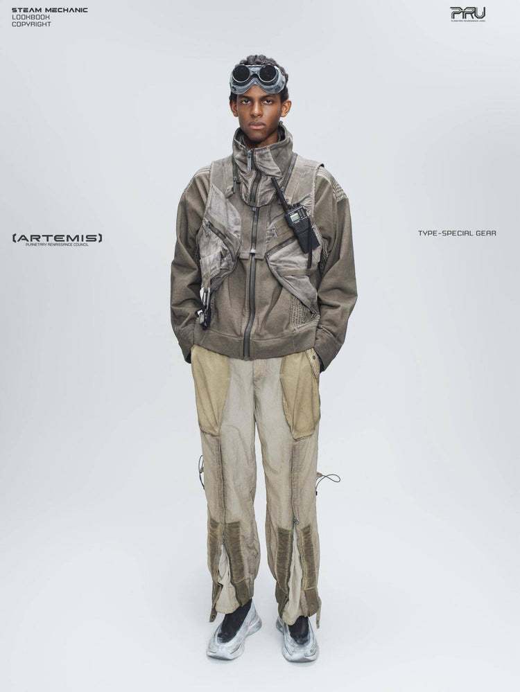 FISSION modular vest — mercury brown full-length front modeled view with hands in trouser pockets