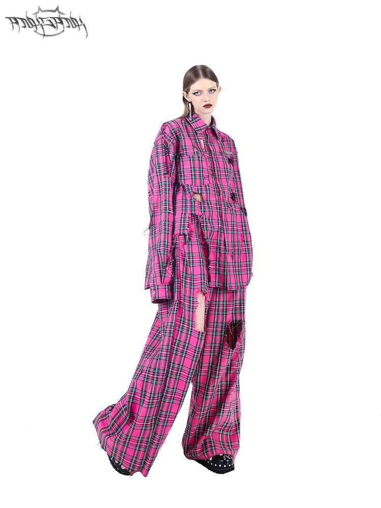 PINKSPINK PINK RIOT distressed plaid wide-leg pants — pink plaid walking pose showing the extra-wide legs