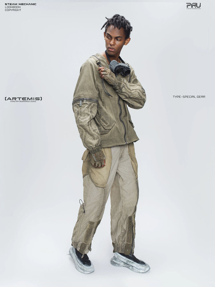 STARCORE mercury brown engineer utility pants — full-length modeled view without the vest, holding a shoulder strap