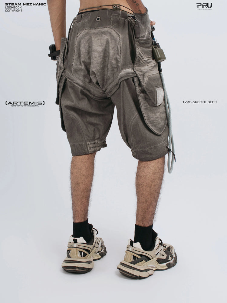 ARTEMIS xirang brown detachable technical shorts — rear view showing right pocket and articulated panels