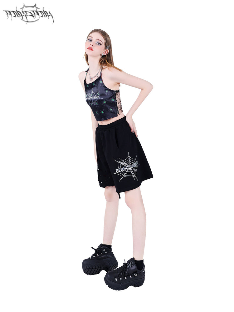 PINKSPINK SPIDER web-mesh halter crop top — front three-quarter modeled view styled with shorts
