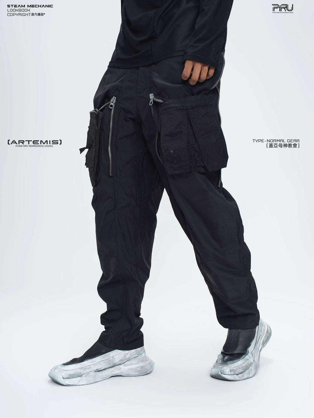 GAIA stone green curved-blade technical pants — construction detail