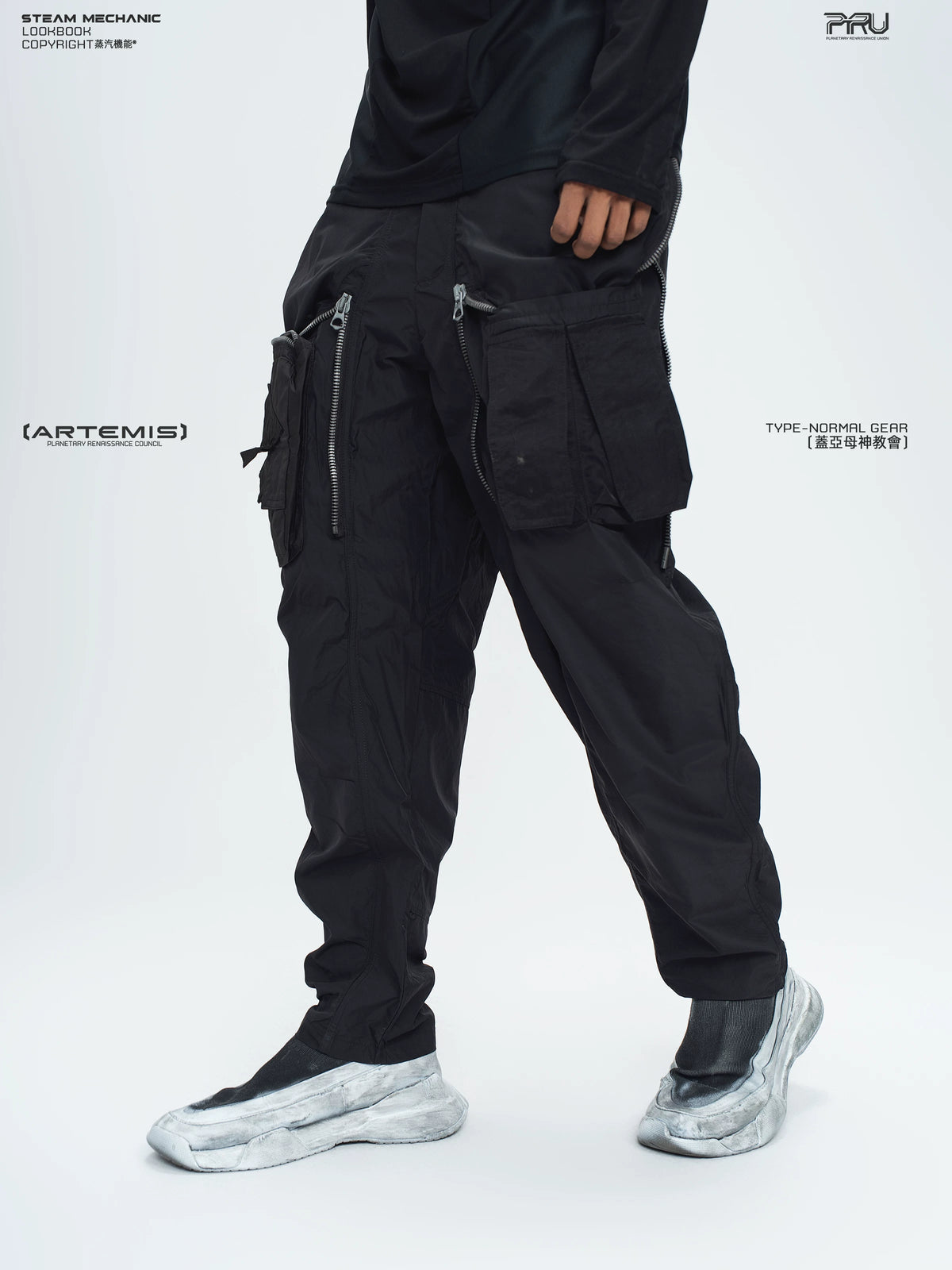 GAIA stone green curved-blade technical pants — construction detail
