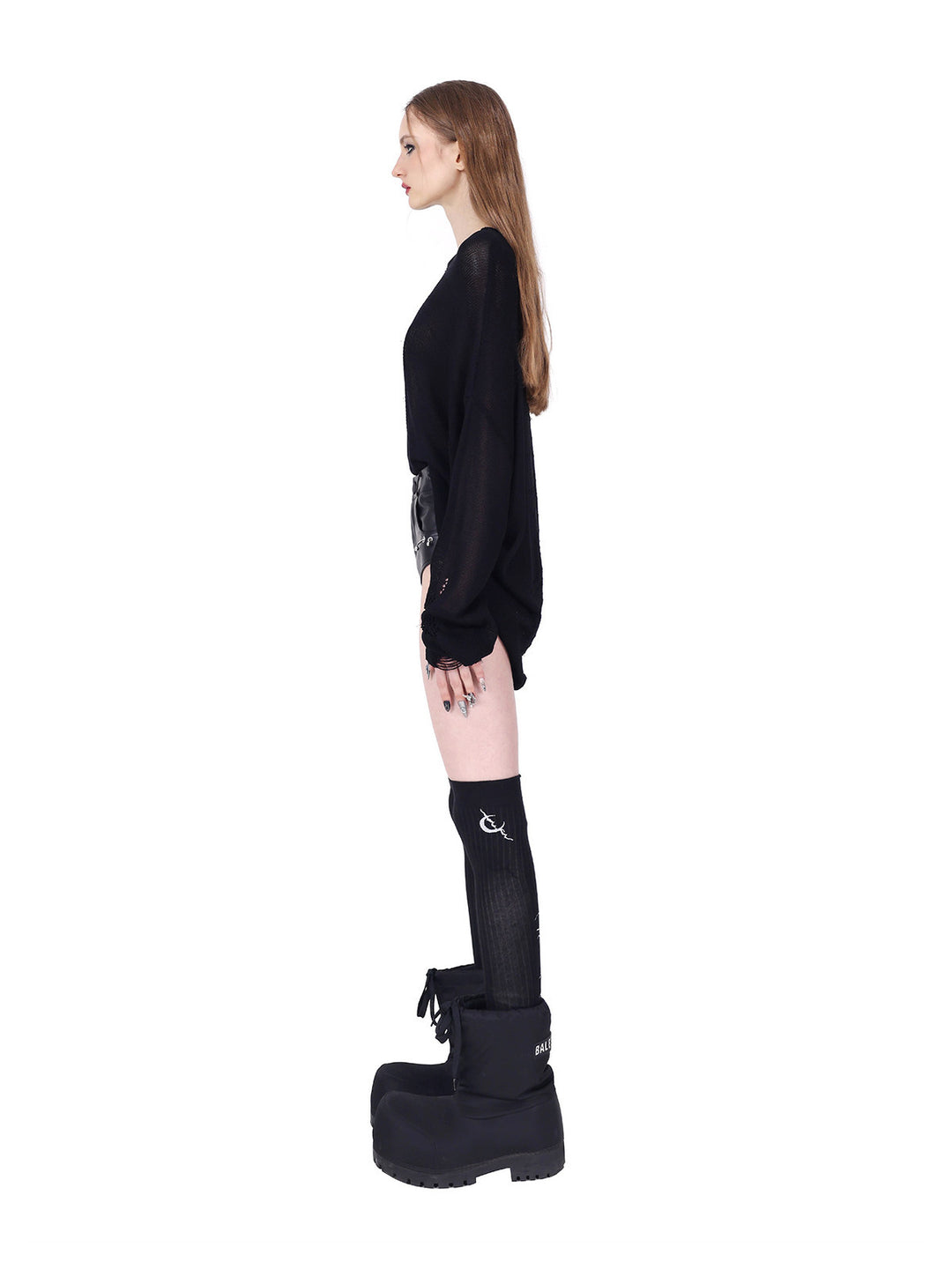 PINKSPINK ELECTRIC MOON distressed open-knit sweater in black — full-length side view styled with separate shorts