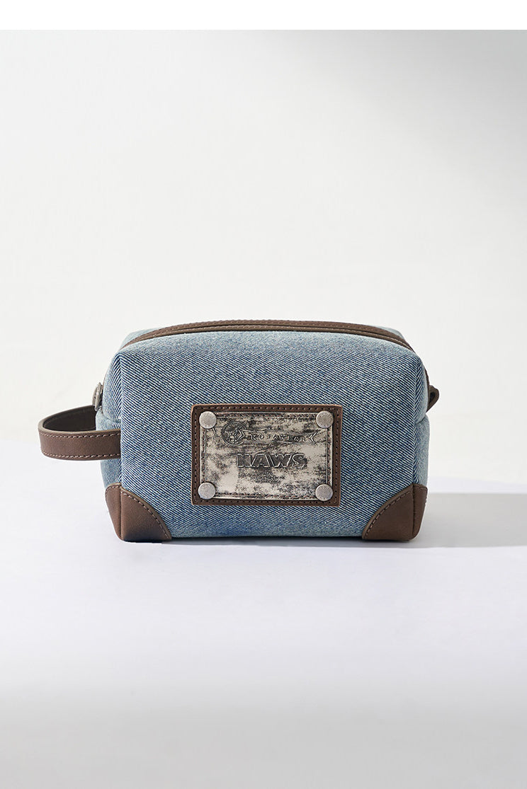 NAWS BLUE BOX denim makeup bag — catalog view showing the design and silhouette
