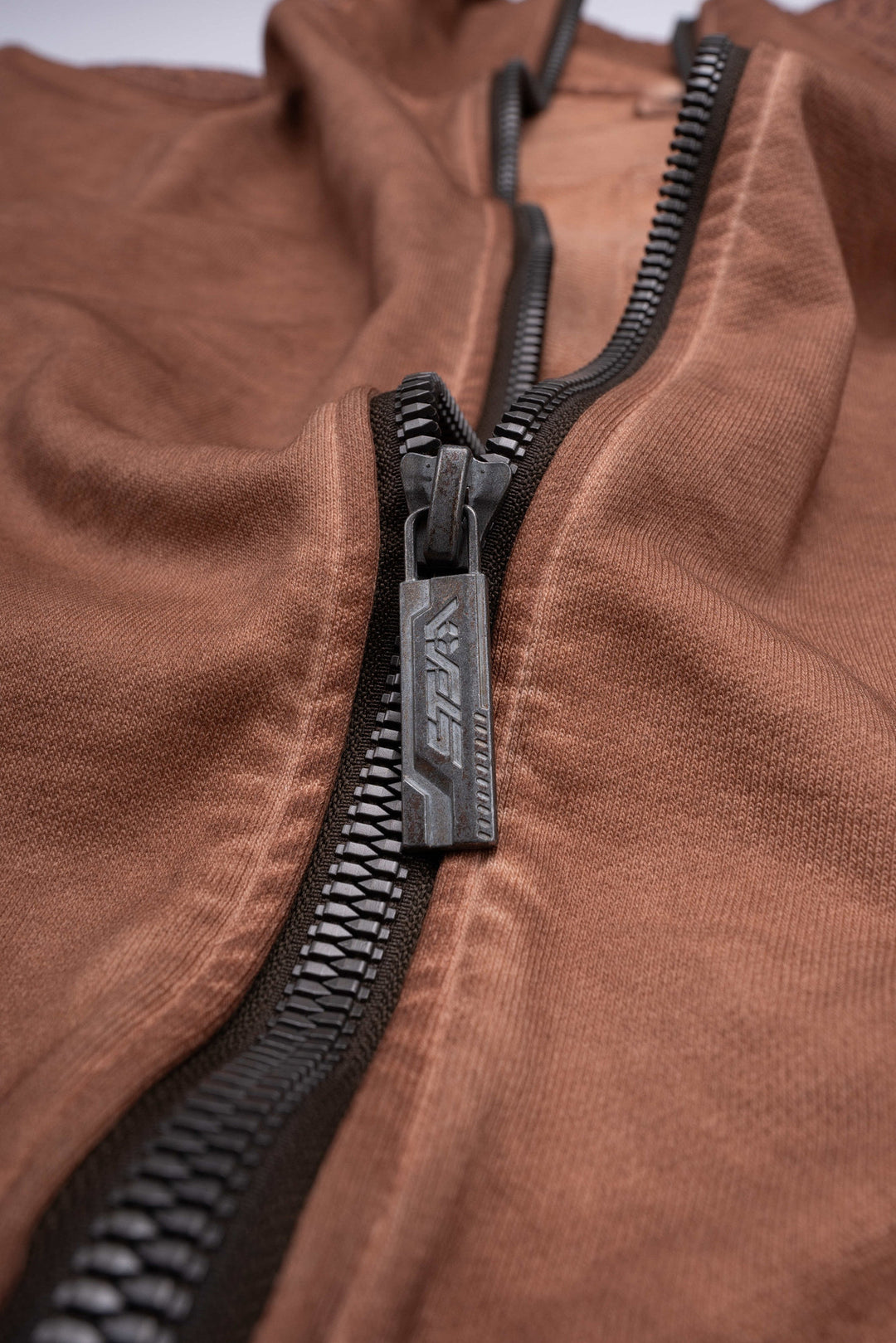 PIONEER venus orange distressed protection zip jacket — close-up of the branded metal zipper pull and washed cotton fabric