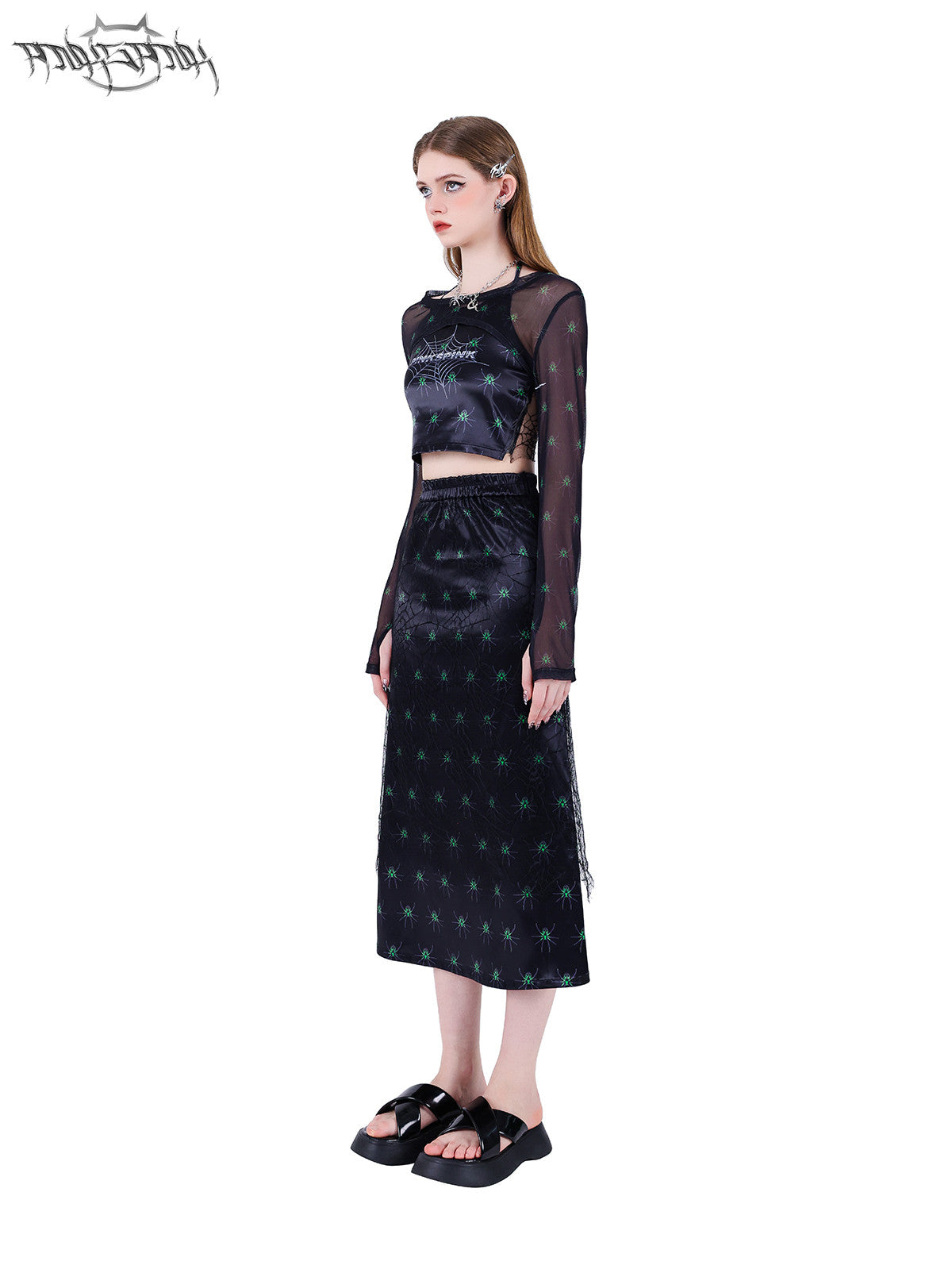 PINKSPINK SPIDER web-mesh long-sleeve shrug — side full-length modeled view styled with the long skirt