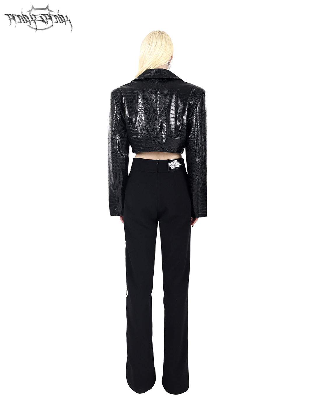 PINKSPINK FLAME BUCKLE — Black jacket, rear view styled with trousers.