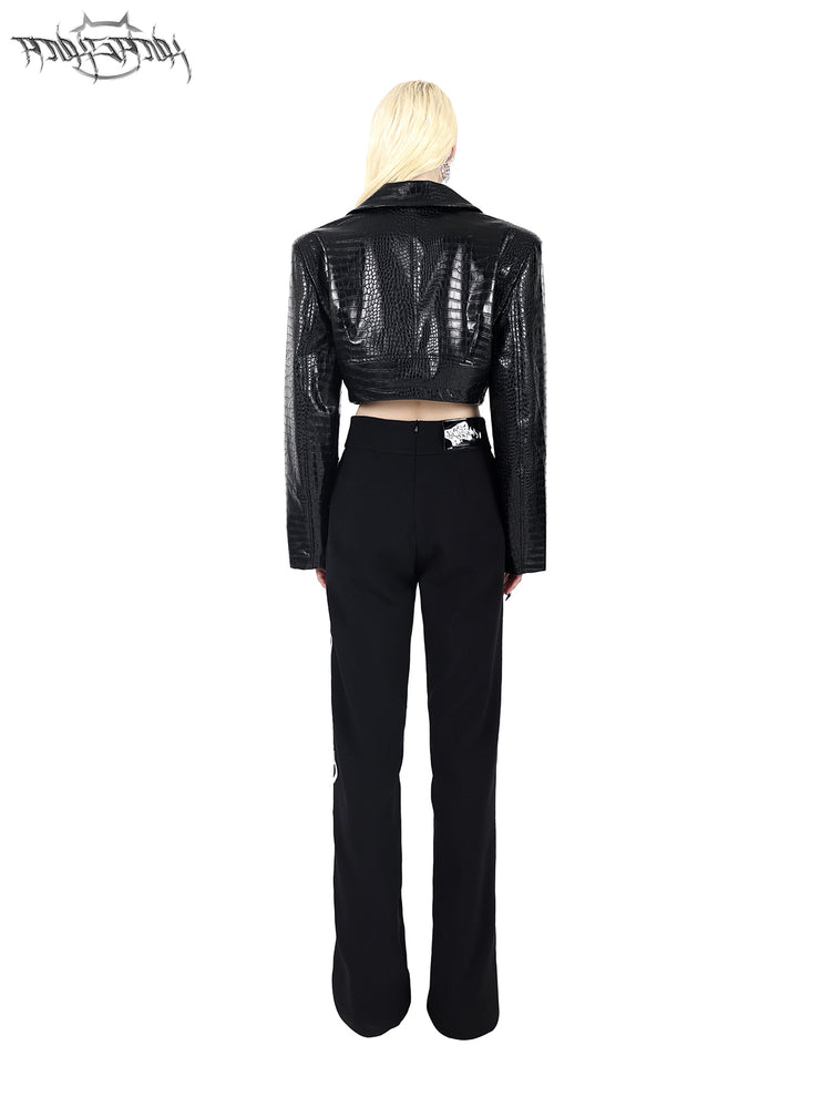 PINKSPINK FLAME BUCKLE — Black jacket, rear view styled with trousers.