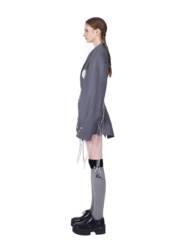 PINKSPINK ELECTRIC MOON diamond-chain belt skirt in black and silver — full-length side view styled over a gray blazer