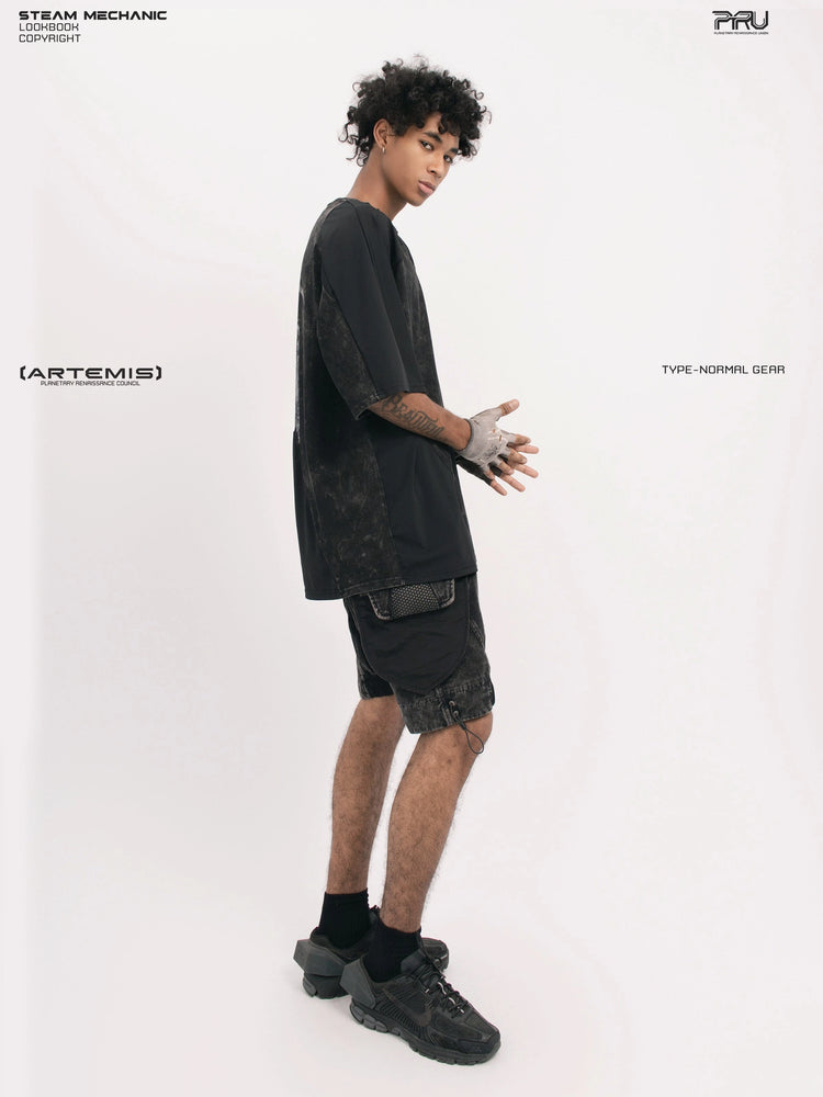 STARCORE black tortoise velcro mesh tee — side modeled view with hands clasped