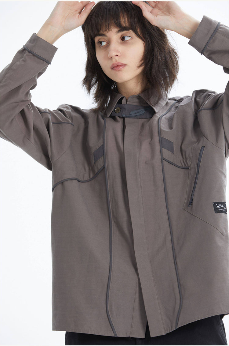ERRORCODE ROBOT taupe tech work shirt — front modeled view with hands raised