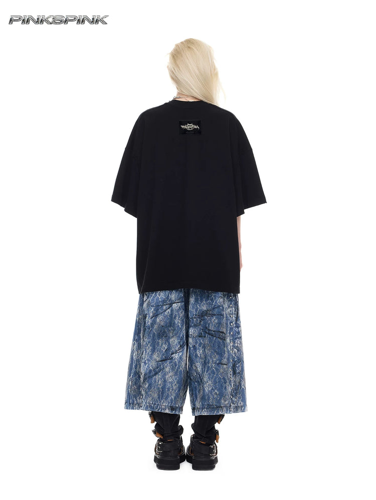 PINKSPINK ELECTRIC MOON lace-coated wide-leg denim shorts in blue — full-length back modeled view showing the wide cropped legs