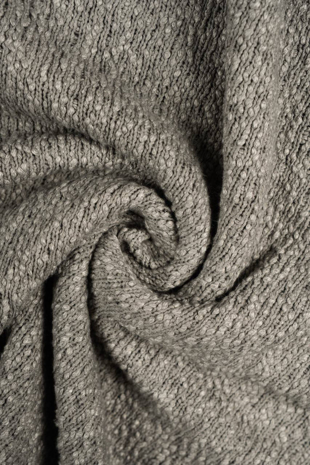 ARTEMIS distressed reversible knit sweater — close-up of the mottled knit texture and soft folded fabric