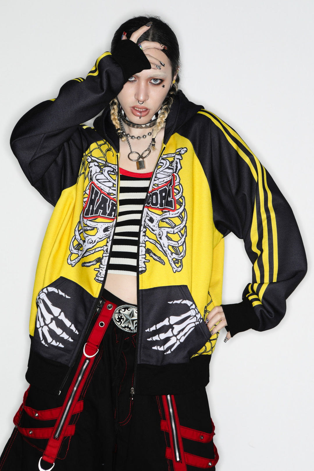 DeadEndKids Hardcore Generation skeleton zip-up hoodie — modeled front, hand to hood
