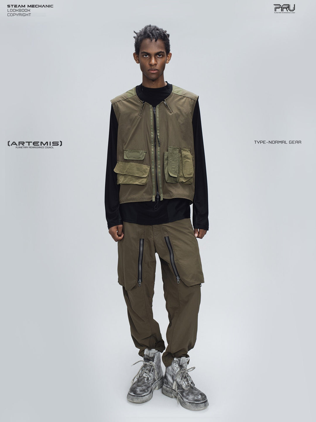 GAIA curved-blade technical pants in mountain green — full-length front styling view with a matching vest