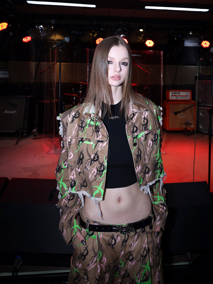 PINKSPINK ELECTRIC MOON sculpted camo cargo trousers in CAMOUFLAGE — close front showing waistband.