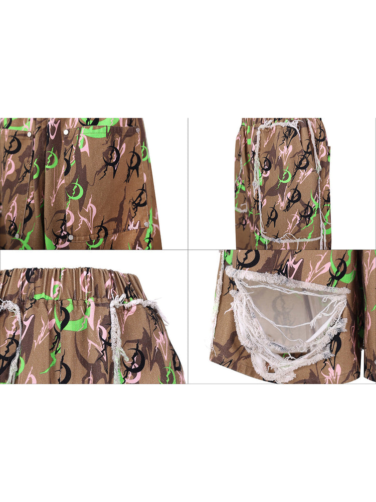 PINKSPINK ELECTRIC MOON distressed camo cropped trousers in CAMOUFLAGE — four-panel print,pocket,elastic-waist and distressed-opening details.