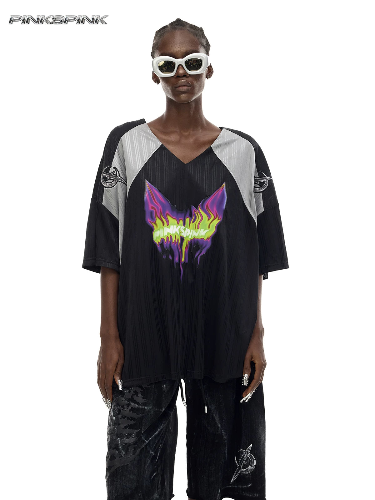 PINKSPINK FLAMECAT oversized sports jersey in black and gray — close front view of the V-neck, shoulder emblems and neon graphic